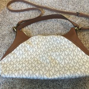 Michael Kors handbag with shoulder strap. Light cream color, tan & gold accent